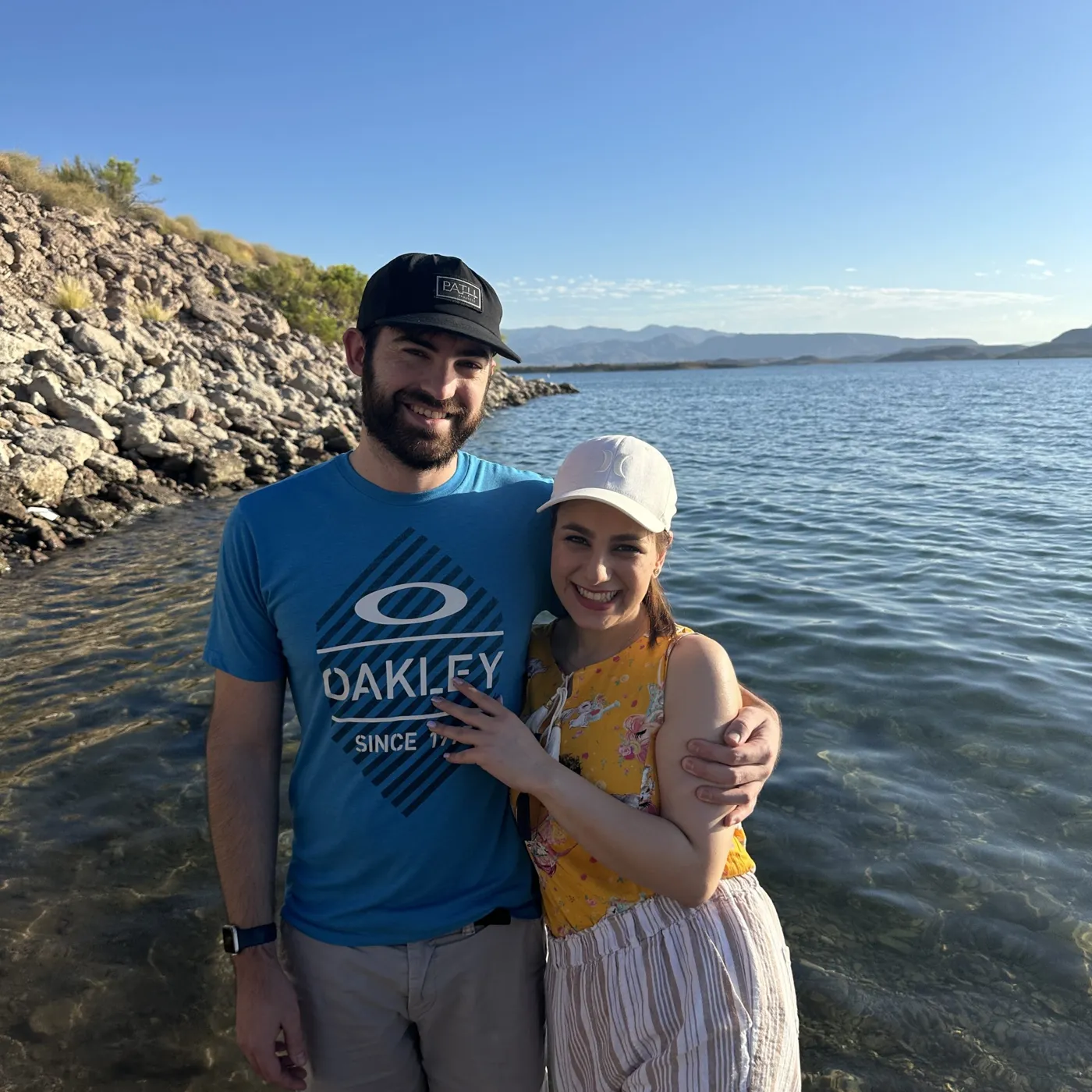 Travelers enjoying a sunny day beside a lake